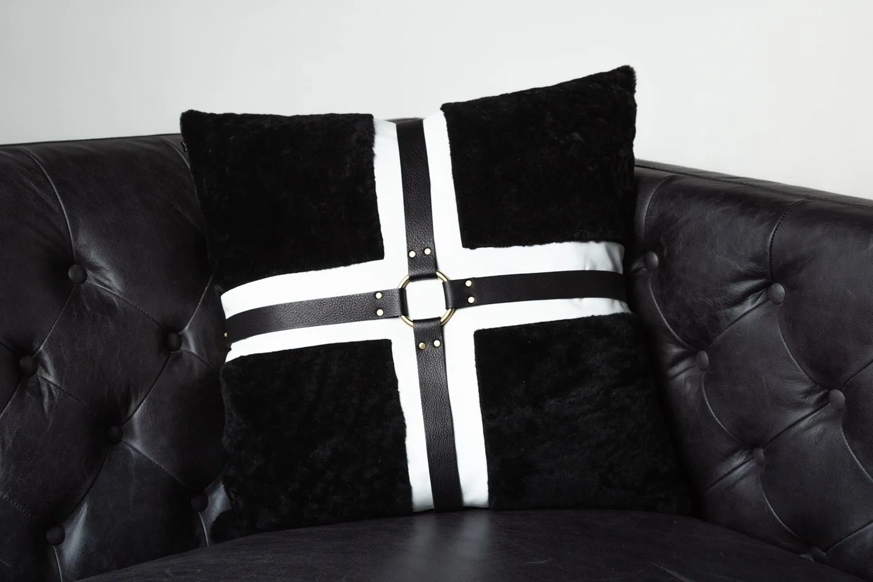 Black shearling harness pillow