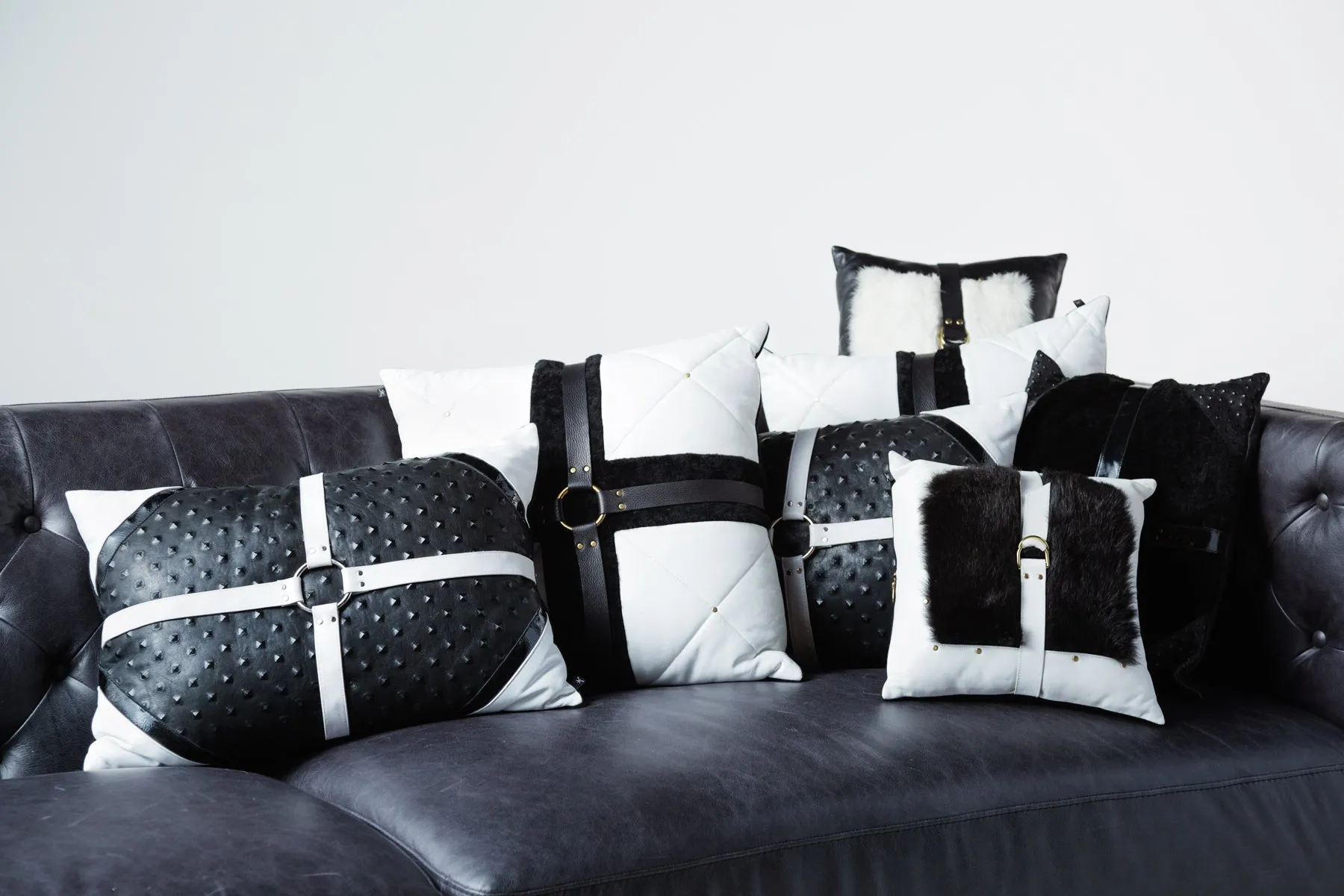 Black shearling harness pillow