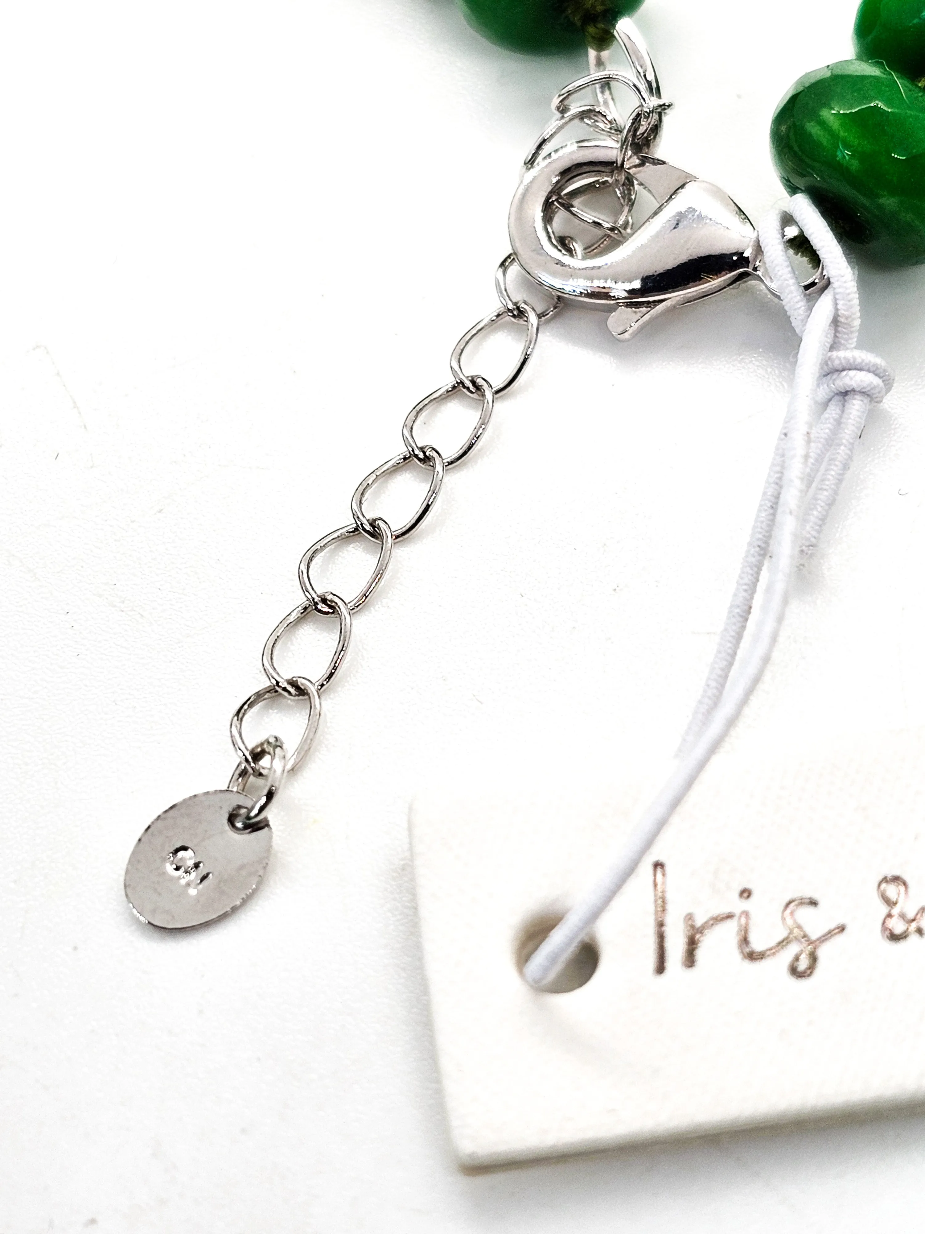 Iris and Lilly Emerald beaded rondelle cut silk strung silver plated necklace